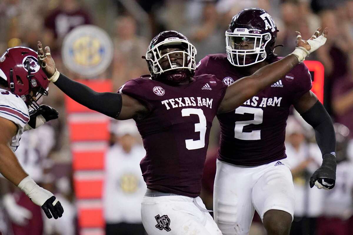 Texas A&M defensive lineman Tyree Johnson (3) reacts after sacking South Carolina quarterback Zeb Noland (not shown) for a loss of six yards by during the first half of an NCAA college football game on Saturday, Oct. 23, 2021, in College Station, Texas. (AP Photo/Sam Craft)