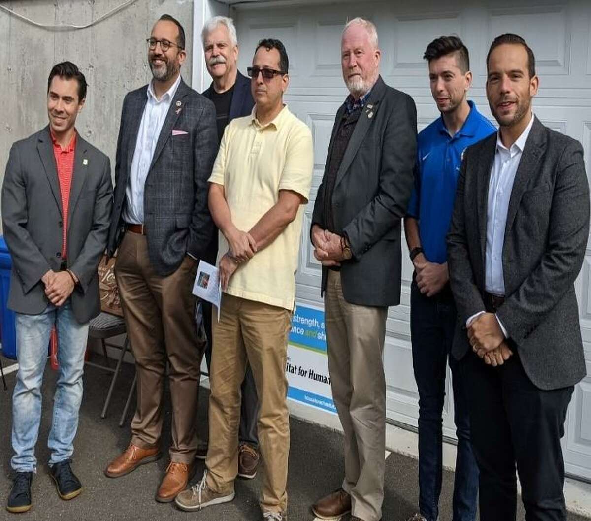 The employees and volunteers of Housatonic Habitat for Humanity dedicated a house to a new homeowner, Fernando Franco. From left to right: State Rep. David Arconti, D-Danbury, Roberto Alves, Danbury City Council member, State Rep. Bob Godfrey, D-Danbury, Franco, State Rep. Ken Gucker, D-Danbury, Joe Britton, Danbury school board member, Farley Santos, Danbury City Council member.