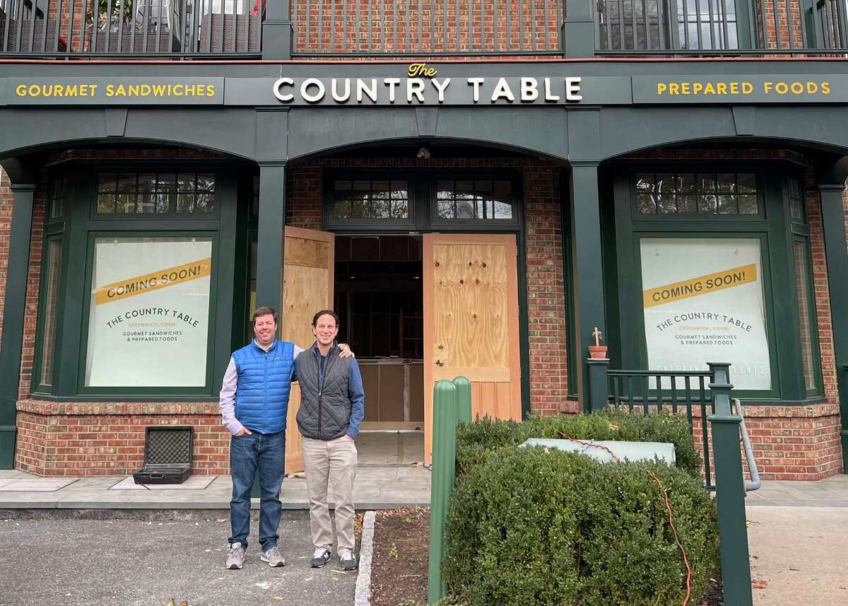 Owners Geoff Lazlo, left, and Greg Oshins stand outside The Country Table, a specialty prepared-foods market scheduled to open on or around Dec. 1, 2021 at 1 Glenville St., in Greenwich, Conn.