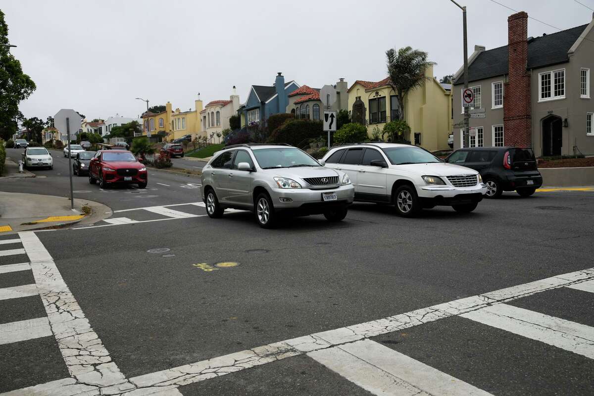 Vehicles travel through the San Francisco intersection of Monterey and Ridgewood in September. Last year, Liz Colomello was thrown more than 15 feet at this intersection after a speeding driver hit her during her walk in the Sunnyside neighborhood.