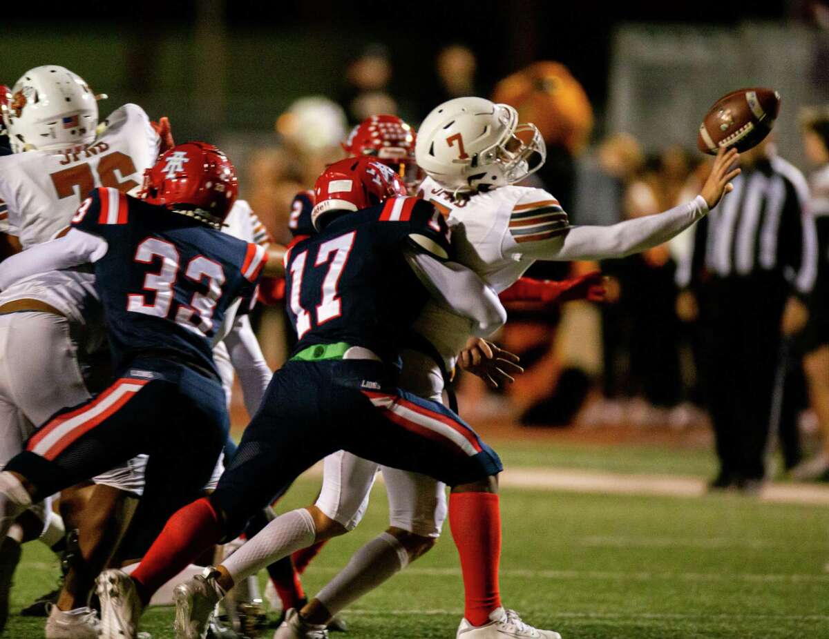Alief Taylor LB Collin Germany (17) puts pressure on Alvin Yellowjackets QB Trevor Bockel (7) as Bockel makes a throw during the first half of action between Alvin at Alief Taylor High School during a District 23-6A high school football game at Crump Stadium, Friday, November 5, 2021, in Houston. (Juan DeLeon/Contributor)