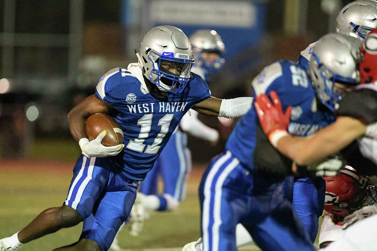 West Haven’s Deven Robinson looks for running room against Cheshire on Friday.
