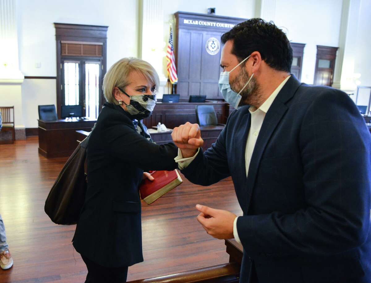 Commissioner Justin Rodriguez greets new Commissioner Trish DeBerry prior to swearing-in ceremonies shortly New Year's Day in the Bexar County Courthouse. A proposed redistricting plan would shift about 40,000 residents from DeBerry’s North Side precinct to Rodriguez’s on the Northwest Side, to provide a more even population distribution prior to the 2022 primary elections.