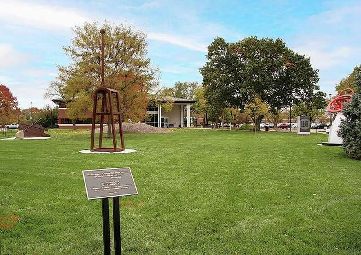 “Immigrant” (from left), “Paradigm Shift” and “Take Five” join nearby sculptures “La Terra” and “Stele Head” to form a sculpture garden on the LLCC-Springfield campus.