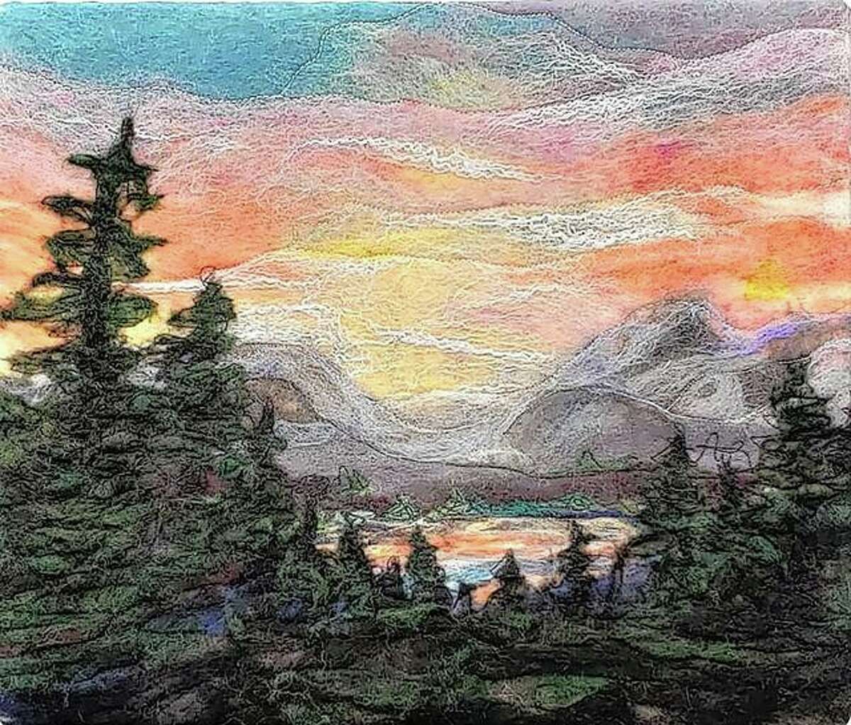 A piece of wool art by fiber artist Anna Repke features a sunset scene, one of her favorite themes.