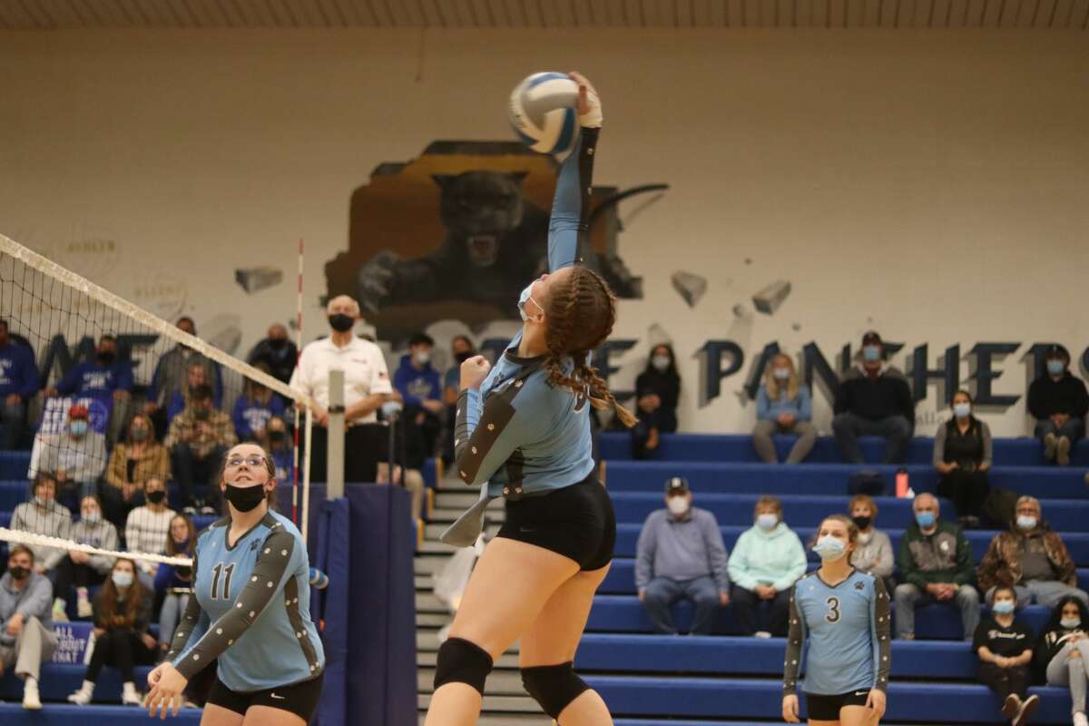 Halle Richardson leaps up to take a big swing during her final volleyball game for the Bobcats on Nov. 5. 