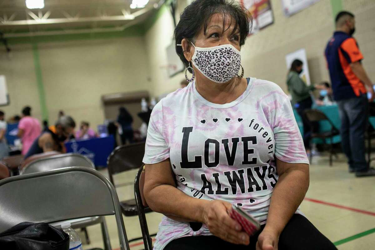 Adelita Flores, 69, waits to be helped during a CPS Energy utility assistance fair held at the Normoyle Community Center in San Antonio, Texas, on Nov. 2, 2021.