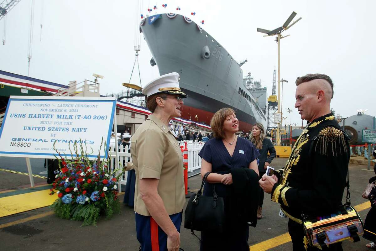 Before the launching of the Harvey Milk, Marine Col. Alison Thompson (left) talks with Jenn Onofrio, a White House fellow to the Navy secretary, and Patrik Gallineaux of the Richmond/Ermet Aid Foundation.
