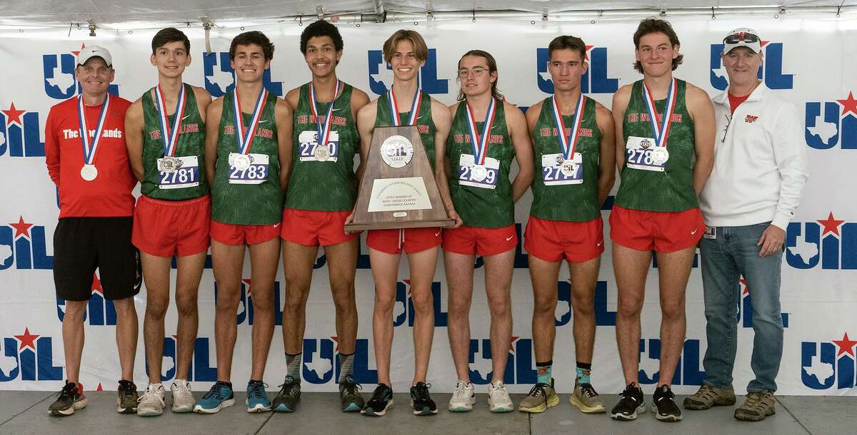The Woodland boys team pose with medals and second place trophy during the 2021 UIL 6A Cross Country State Championship, Saturday, Nov., 6, 2021, in Round Rock, Texas.