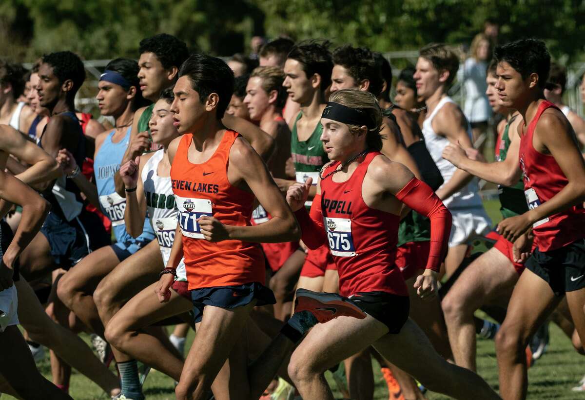 Katy Seven Lakes Ruben Rojas, (2712), and Coppell Andrew Mullen, (2675), center, head out with the pack from the starting line during the 2021 UIL 6A Cross Country State Championship, Saturday, Nov., 6, 2021, in Round Rock, Texas. Rojas finished in third and Mullen in seventh.