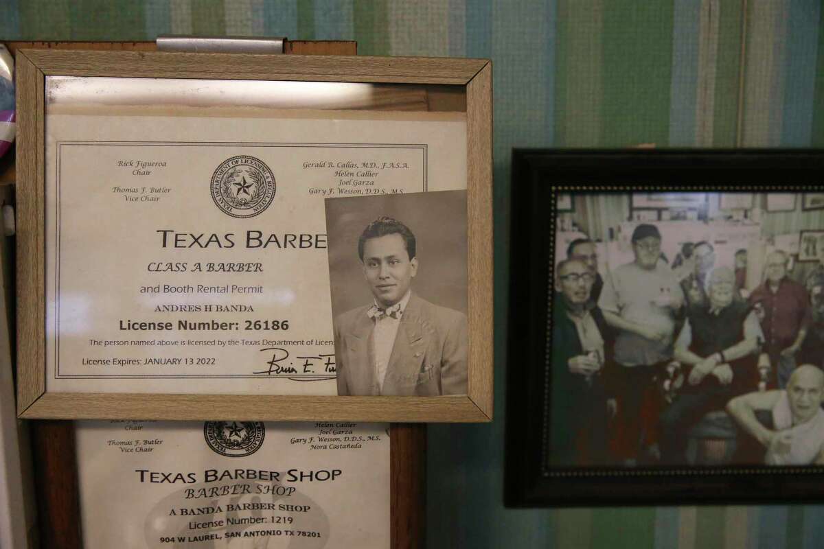 Andy Banda, 96, license hangs on the wall at Andy’s Barber Shop in the Five Points neighborhood Wednesday. Banda bought the business in November of 1951, and now, due to illness, will close the shop and retire. He became a barber in 1946 soon after returning from WWII.