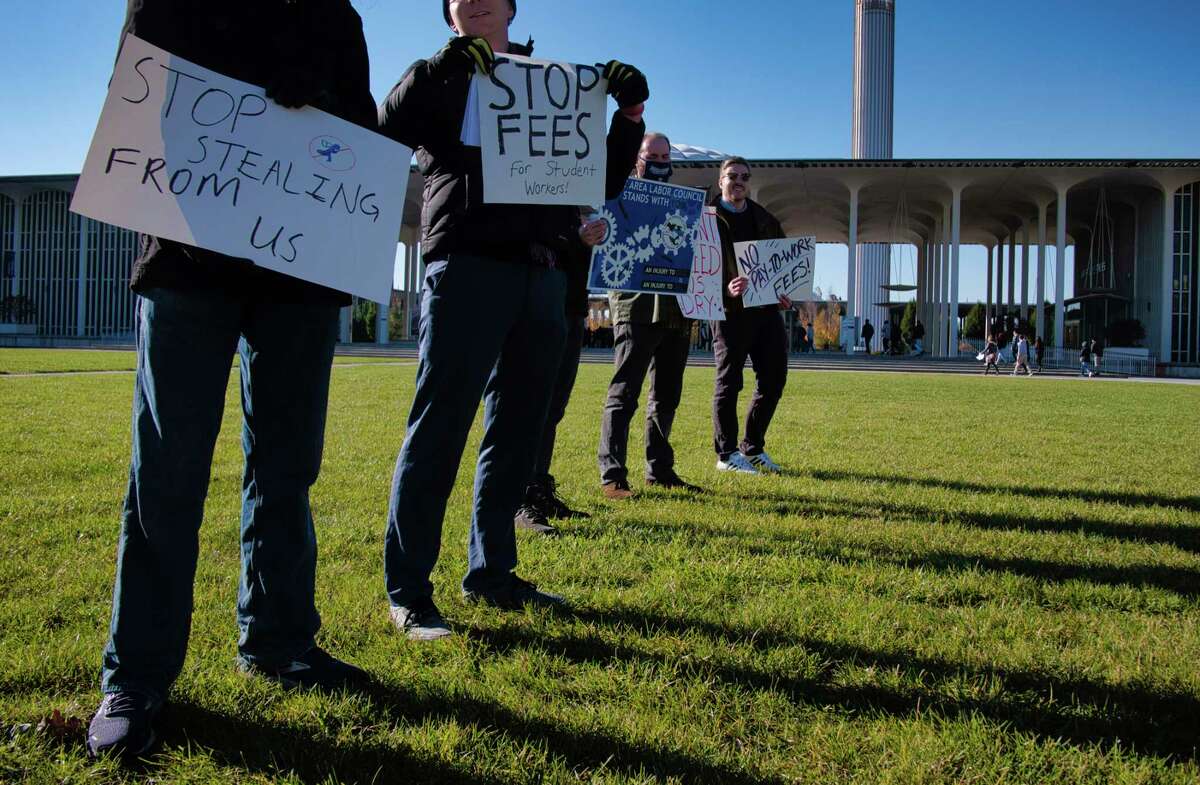 UAlbany teaching assistants hold a protest on the campus during the fall preview day for prospective students and their parents on Sunday, Nov. 7, 2021, in Albany, N.Y. The graduate students say that the university is taking money out of their pay as student fees.