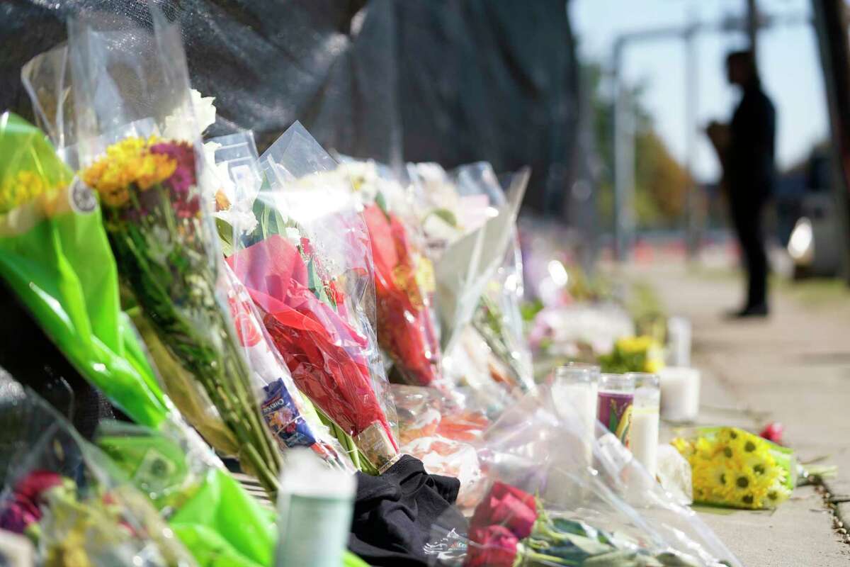 A memorial of flowers, candles, and other items is shown along Westridge St. at Kirby Dr. in NRG Park Sunday, Nov. 7, 2021 in Houston. Eight were killed and multiple people were injured as Travis Scott was performing at Saturday’s Astroworld Festival.