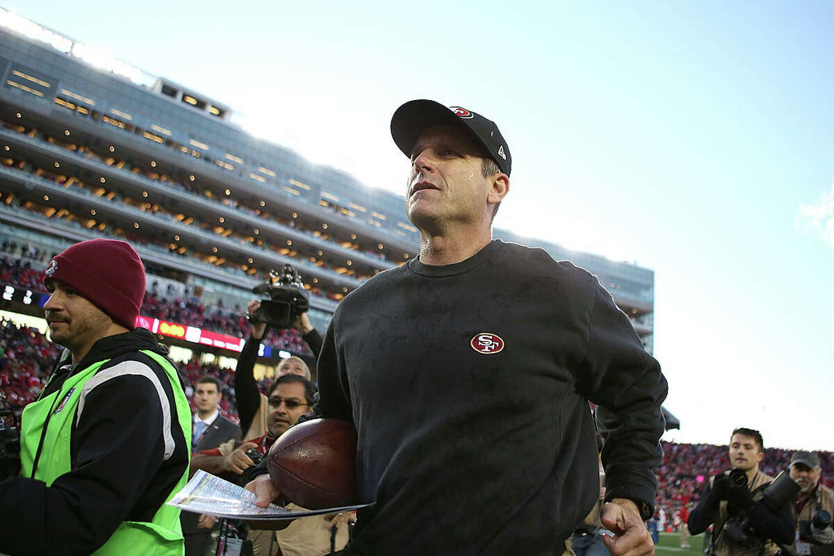 Former head coach Jim Harbaugh of the San Francisco 49ers leaves the field after their win over the Arizona Cardinals at Levi's Stadium on December 28, 2014,