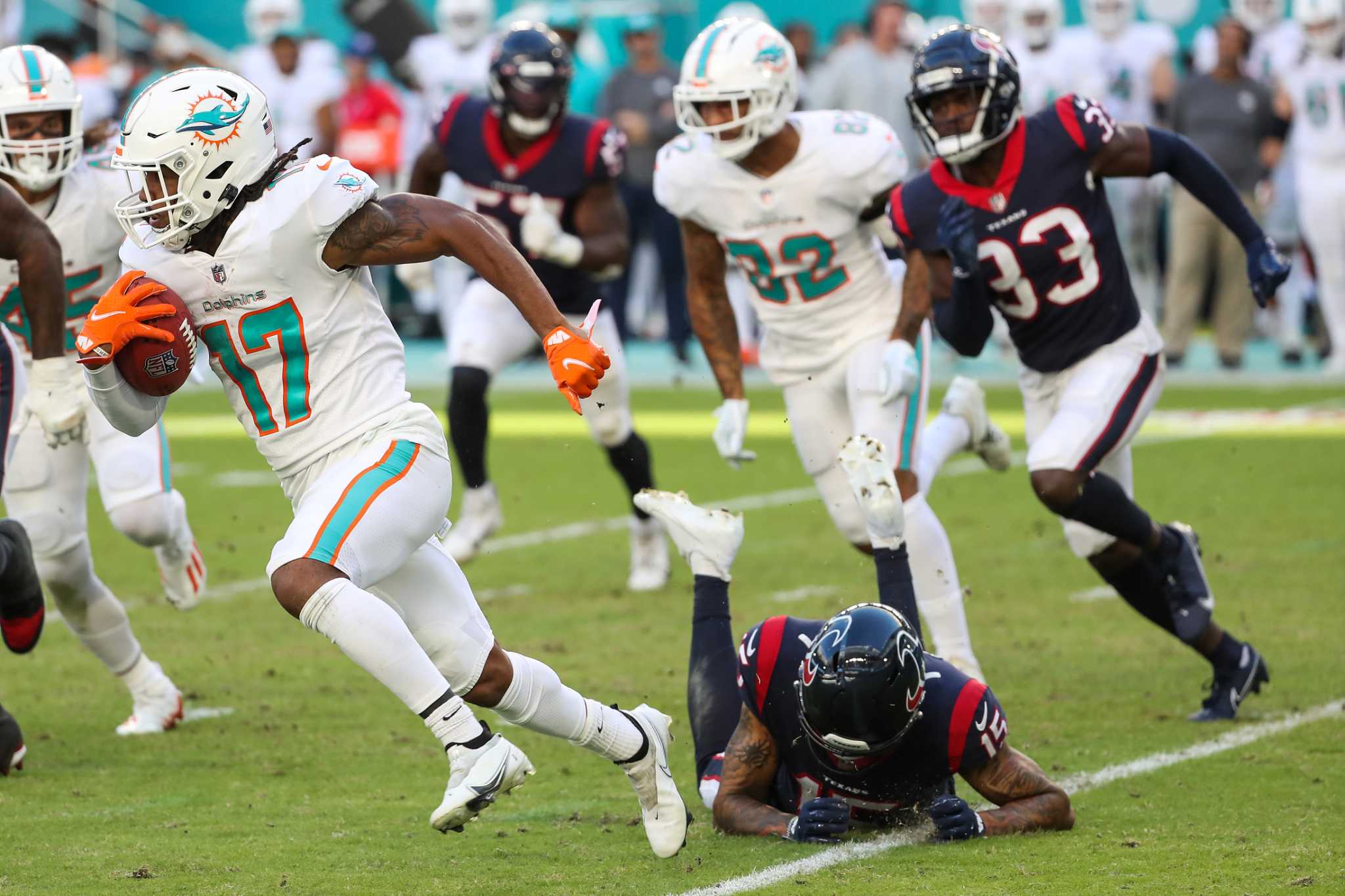 Miami Dolphins tight end Mike Gesicki (88) runs onto the field as he is  introduced to the fans before an NFL football game between the Houston  Texans and the Miami Dolphins, Sunday