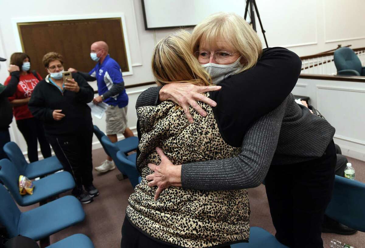 Debby Evangelista (back to camera) hugs West Haven Mayor Nancy Rossi after the results were announced in a recount of the mayoral race giving Rossi a 32 vote edge over challenger Barry Lee Cohen at City Hall in West Haven on Nov. 7, 2021.