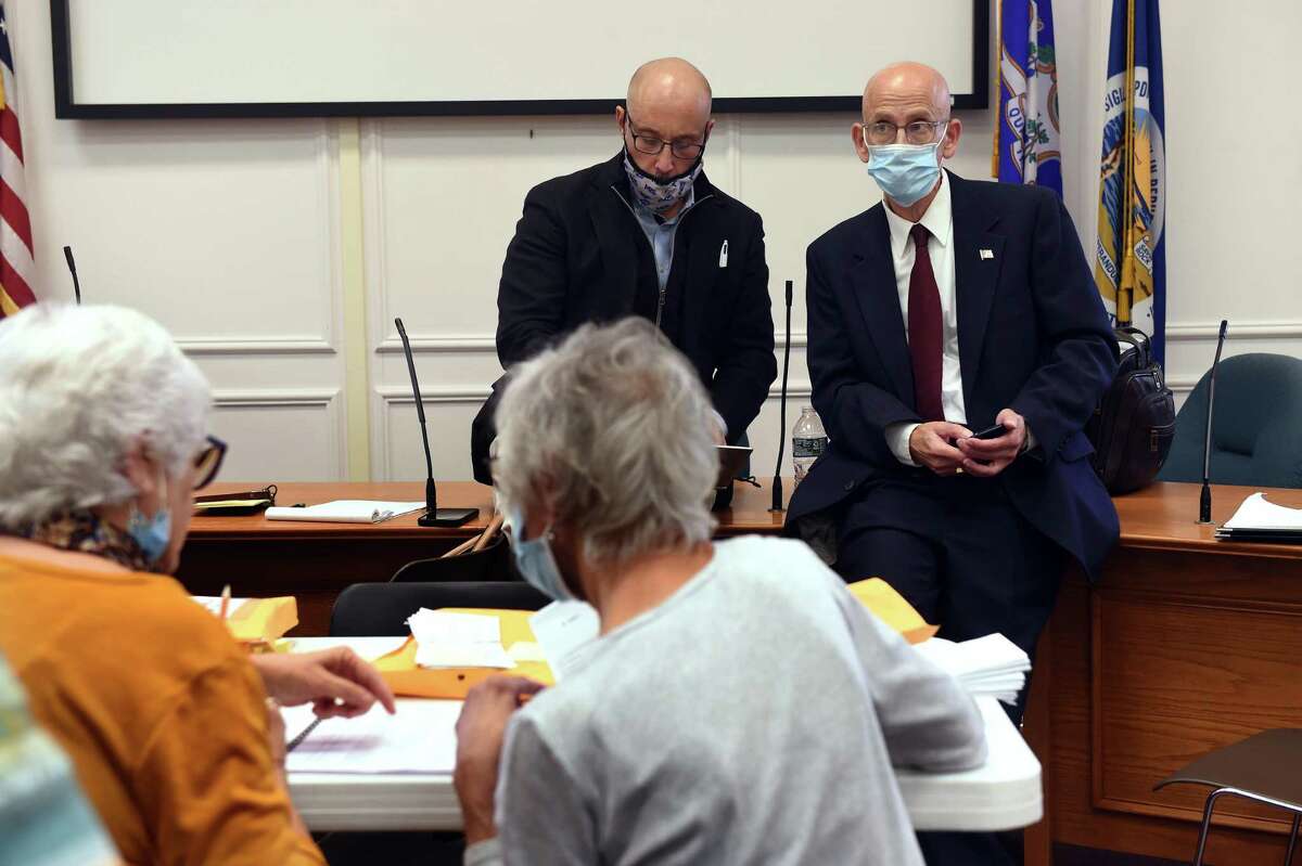 Barry Lee Cohen (right) and his campaign attorney Vincent Marino observe the recount of the mayoral race at City Hall in West Haven on Nov. 7, 2021.