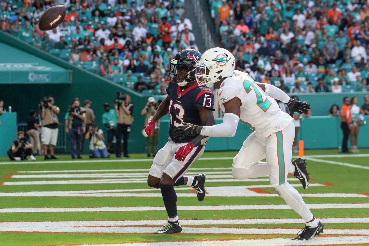 A pass into the end zone intended for Houston Texans wide receiver Brandin Cooks (13), defended by Miami Dolphins cornerback Byron Jones (24), is too far out of reach for an incomplete pass during the first half of an NFL football game Sunday, Nov. 7, 2021, in Miami Gardens, Fla.