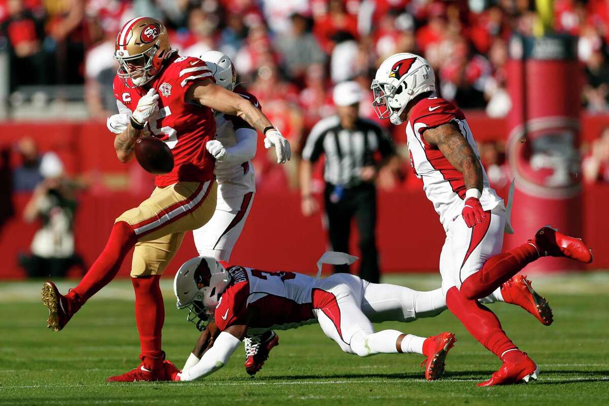 George Kittle fumbles the ball during the first quarter of Sunday’s game against Arizona at Levi’s Stadium.