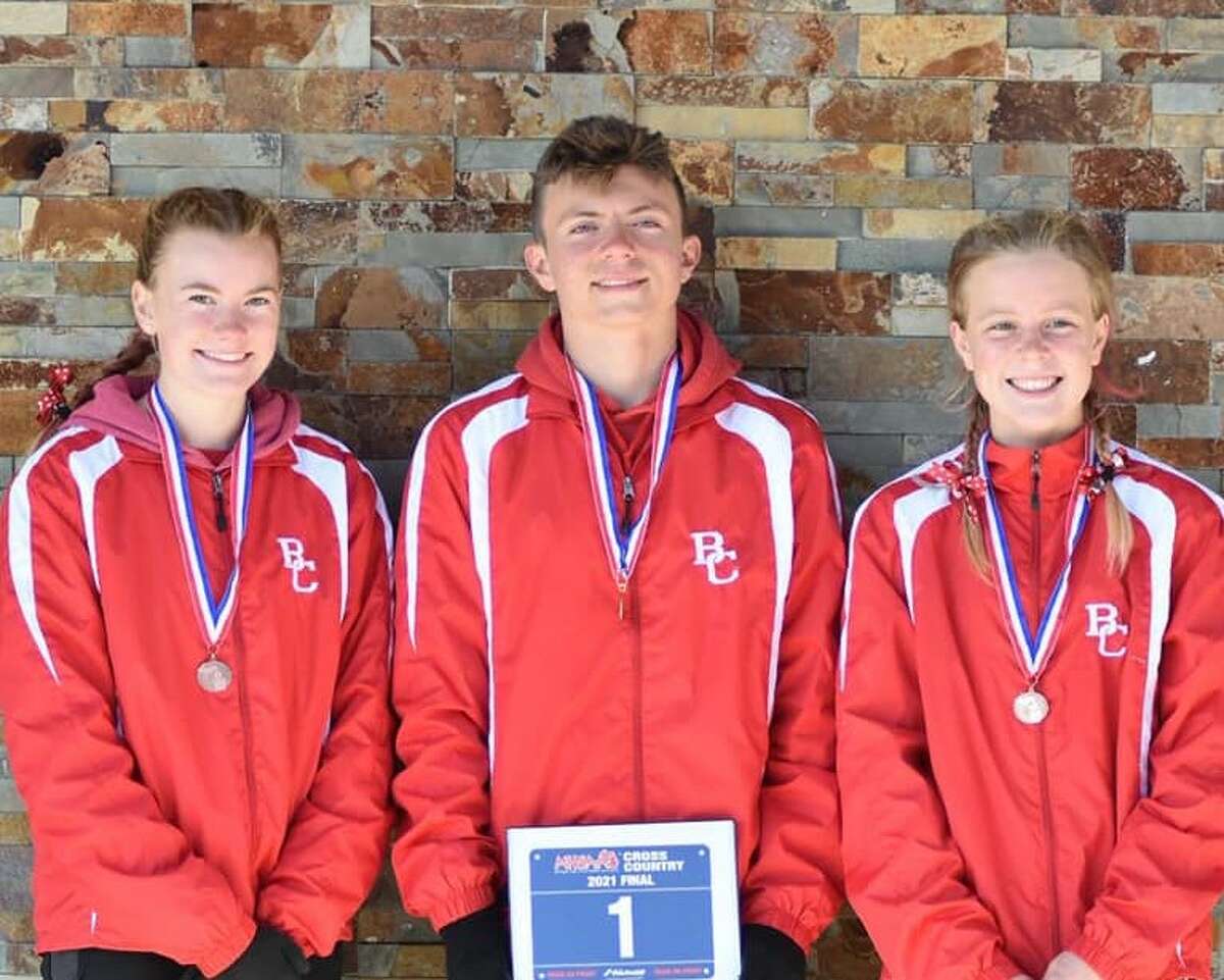 (Pictured left to right) Elise Johnson, Hunter Jones and Mylie Kelly all earned all-state finishes in cross country for Benzie Central, with Jones winning his third straight state championship at Saturday's state finals. 