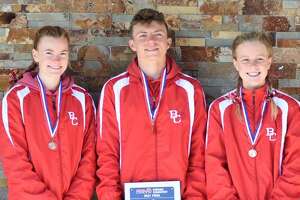 Exciting day for Huskies sees Jones three-peat, three runners finish all-state