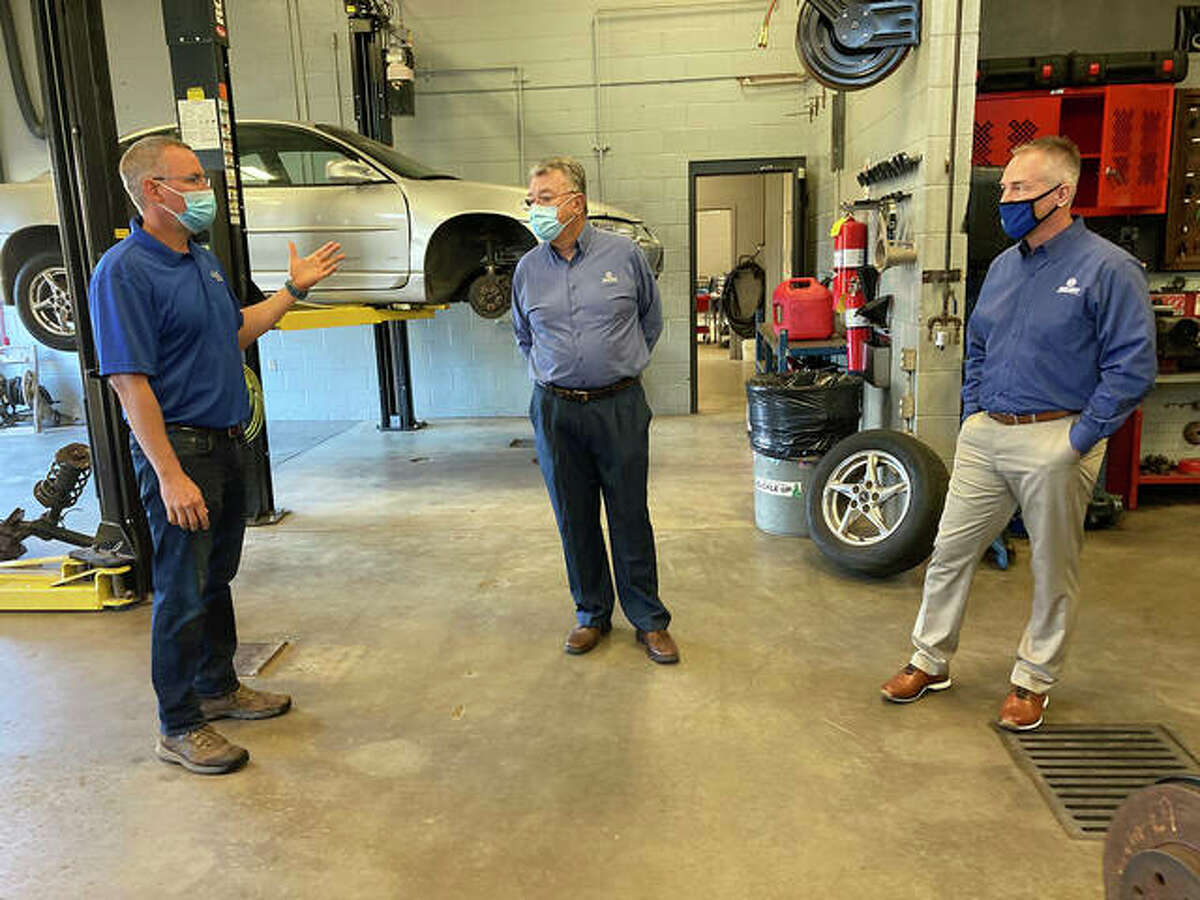Auto Repair Instructor Aaron Schuster, left, gives a shop tour to Jim McKay and Earl Flack in October at the Collinsville Area Vocational Center.