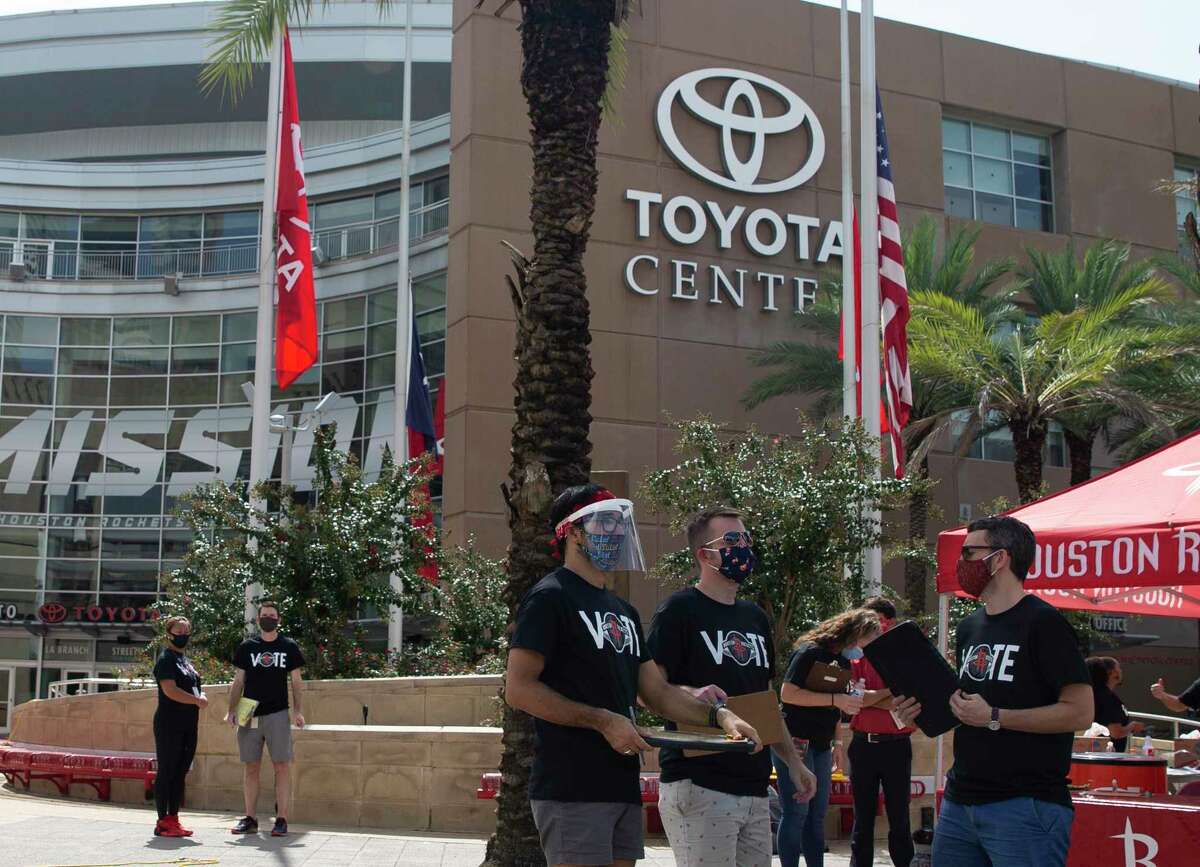 Houston Rockets employees and volunteers help people register to vote during a voter registration drive Friday, Sept. 25, 2020, at Toyota Center in Houston. The event gave people who are eligible the opportunity to register to vote in the upcoming General Election on Nov. 3.