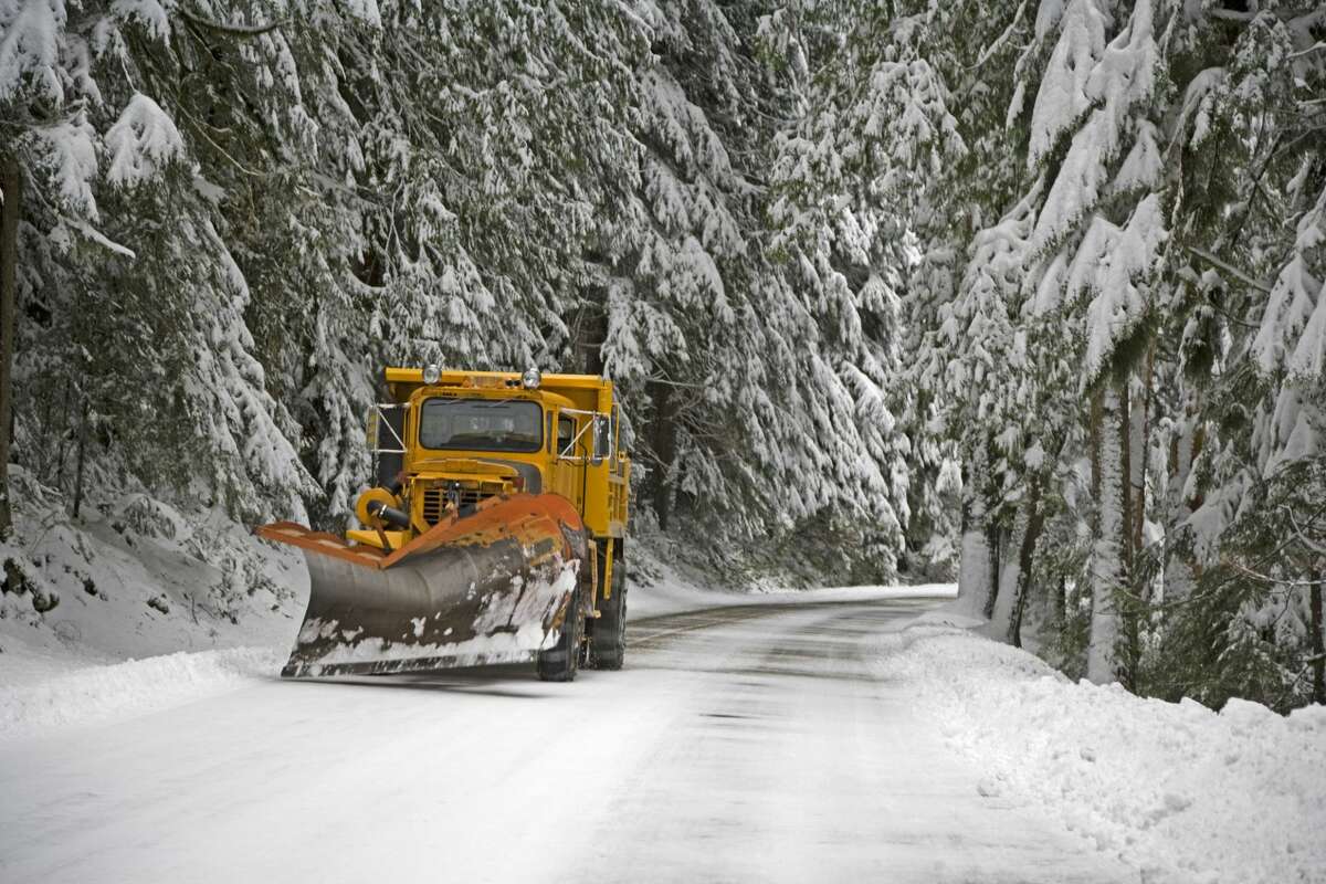A snow plow working on a road up to Paradise at Mt Rainier National Park.