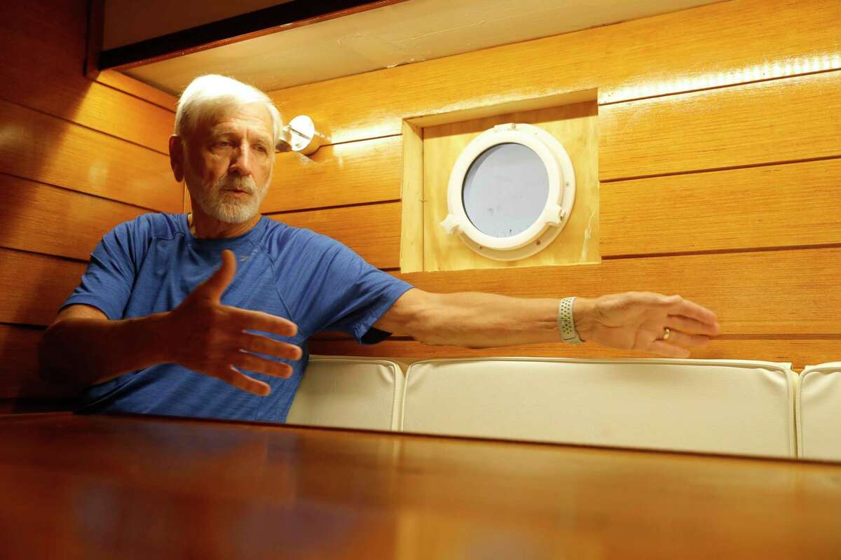 Carey Stanly talks about the multi-use storage he had to consider when building the 33-foot catamaran sailboat he built, Wednesday, Oct. 26, 2021, in Willis. Stanly and several friends sailed for three weeks down the Ohio River in Kentucky on the boat this year.