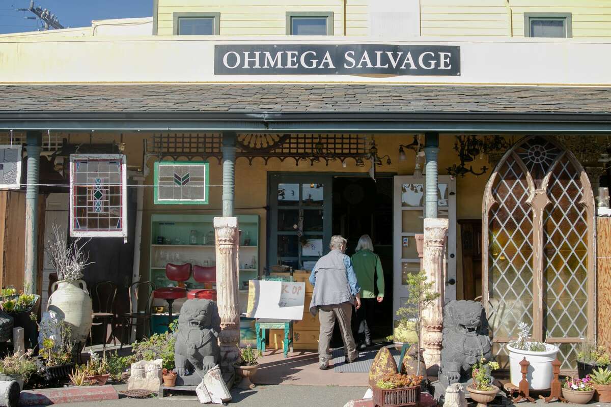 Customers enter Ohmega Salvage in Berkeley, Calif., on Nov. 3, 2021. The store has a large selection of architectural salvage that people use to restore historic homes, among other uses.