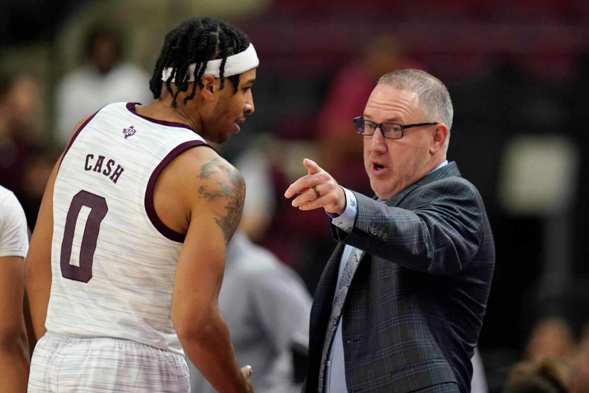 Texas A&M guard Aaron Cash (0) talks to Texas A&M head coach Buzz Williams after coming off the court against Texas A&M Kingsville during the first half of an NCAA college exhibition basketball game Monday, Nov. 1, 2021, in College Station.