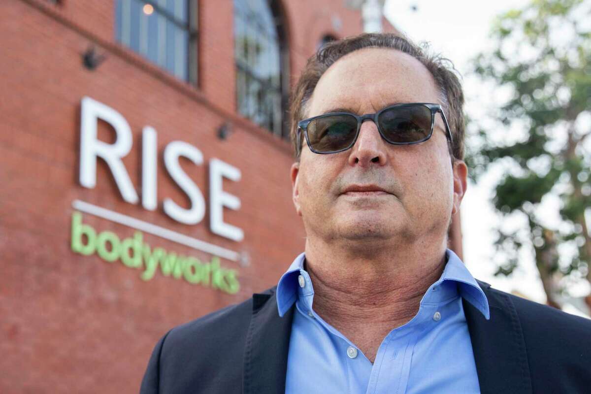 Lawyer John Winer stands outside RISE Bodyworks in Alameda on November 5, 2021. RISE Bodyworks owner and chiropractor John Beall surrendered his license after state officials claimed to have had sex with patients and an employee.  Winer represented a complainant who filed a complaint.