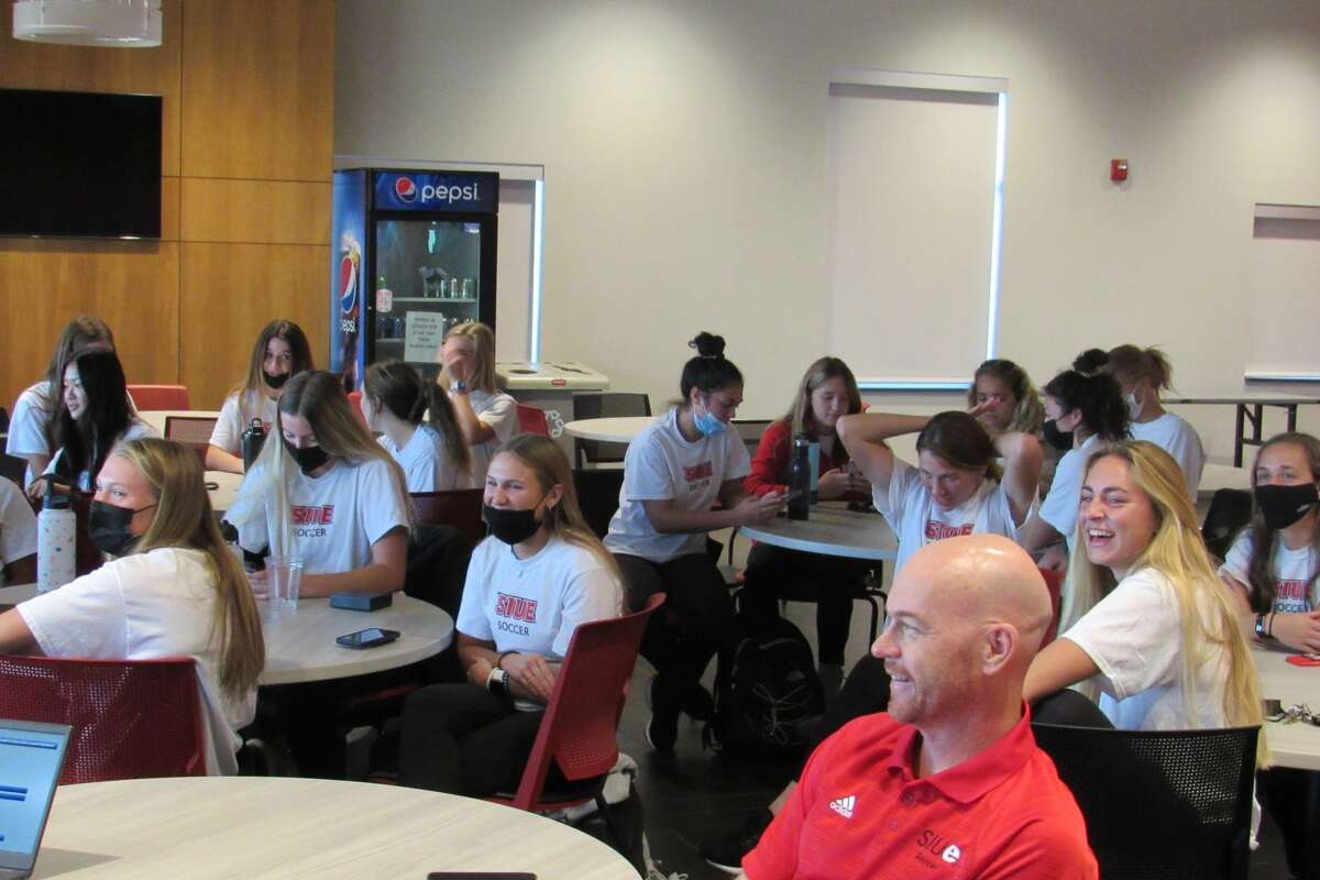 Members of the SIUE women's soccer team smile after hearing its name called in the NCAA Tournament selection show. 