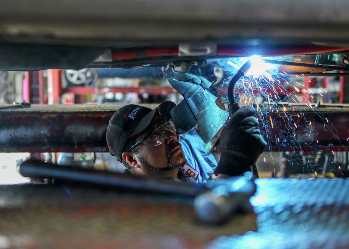 Alberto Pachuca, a mechanic, builds a protective cage for a catalytic converter in a Toyota Prius at Johnny Franklin Muffler on Wednesday, January 24, 2021, in Santa Rosa, Calif.