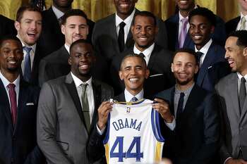 President Barack Obama holds a Warriors jersey during the team's visit to the White House on Feb. 4, 2016, that celebrated Golden State's 2015 NBA title.