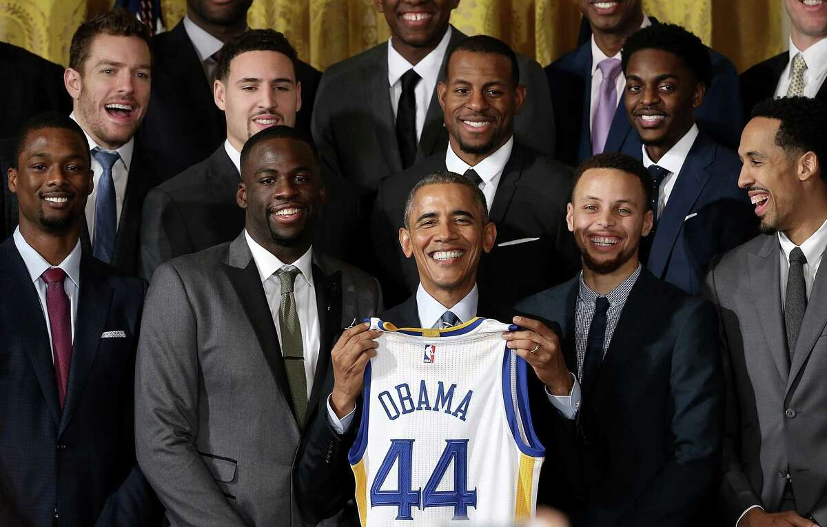 President Barack Obama holds a Warriors jersey during the team’s visit to the White House on Feb. 4, 2016, that celebrated Golden State’s 2015 NBA title.