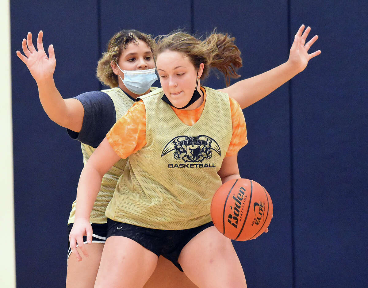 Father McGivney's Charlize Luehmann runs through a drill during a practice for the Griffins.