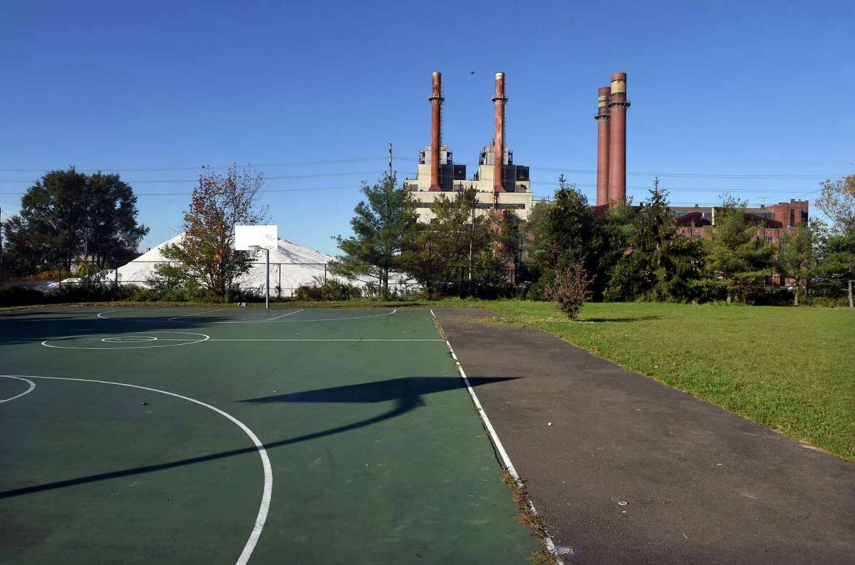 The English Station power plant viewed from the basketball court next to the John S. Martinez School in New Haven Nov. 4, 2021.