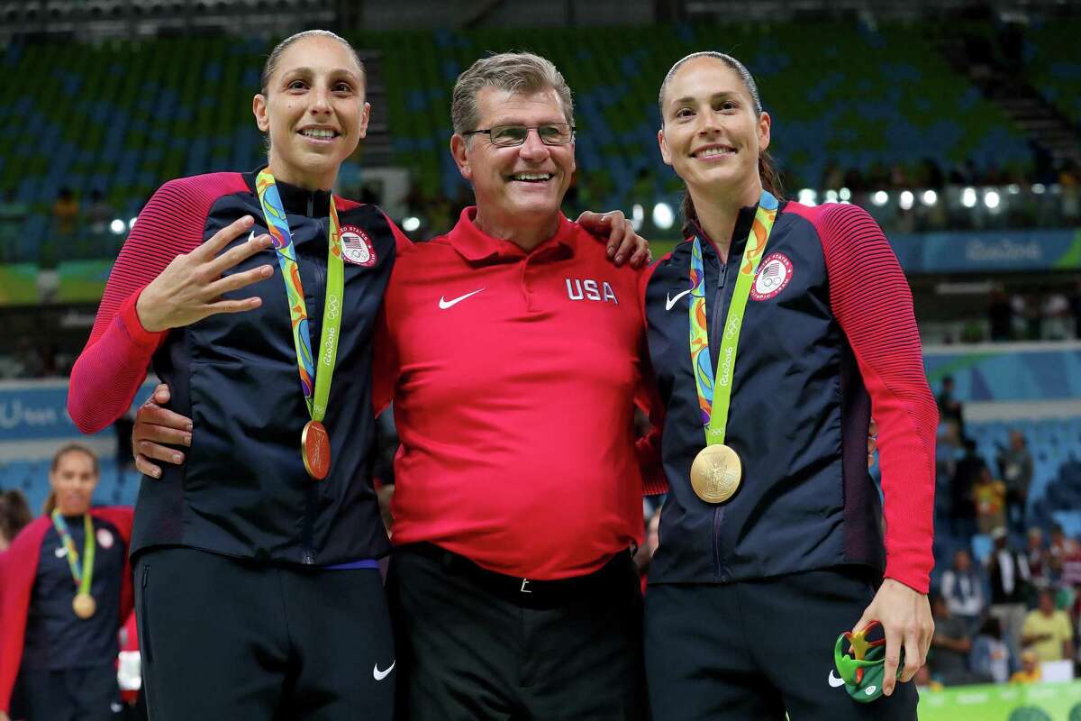(L-R) Gold medalists Diana Taurasi #12, head coach Geno Auriemma and Sue Bird #6 of United States celebrate during the medal ceremony after the Women's Basketball competition on Day 15 of the Rio 2016 Olympic Games at Carioca Arena 1 on August 20, 2016 in Rio de Janeiro, Brazil. (Tom Pennington/Getty Images/TNS)