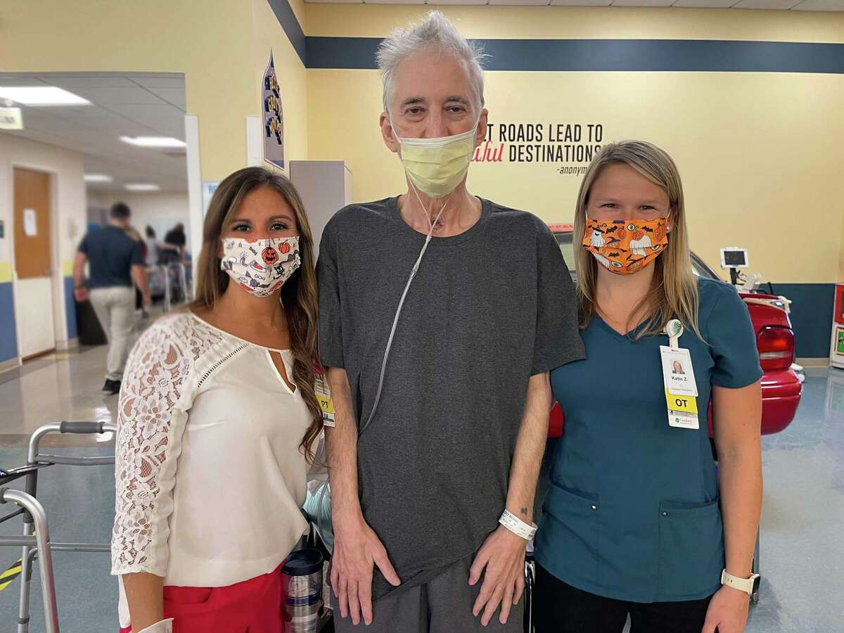 George Kelakos, center, worked with therapists at Gaylord Specialty Healthcare in Wallingford, following a major bout with coronavirus.