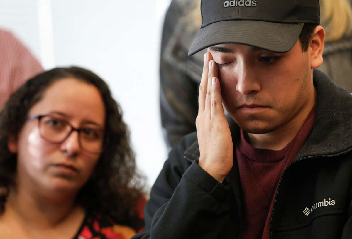Joel Acosta fights back emotion as he listens during a press conference about his brother Axel’s death Monday, Nov. 8, 2021, at the law office of Tony Buzbee in Houston. The family and Buzbee announced a lawsuit in response to his death at the Astroworld music festival.