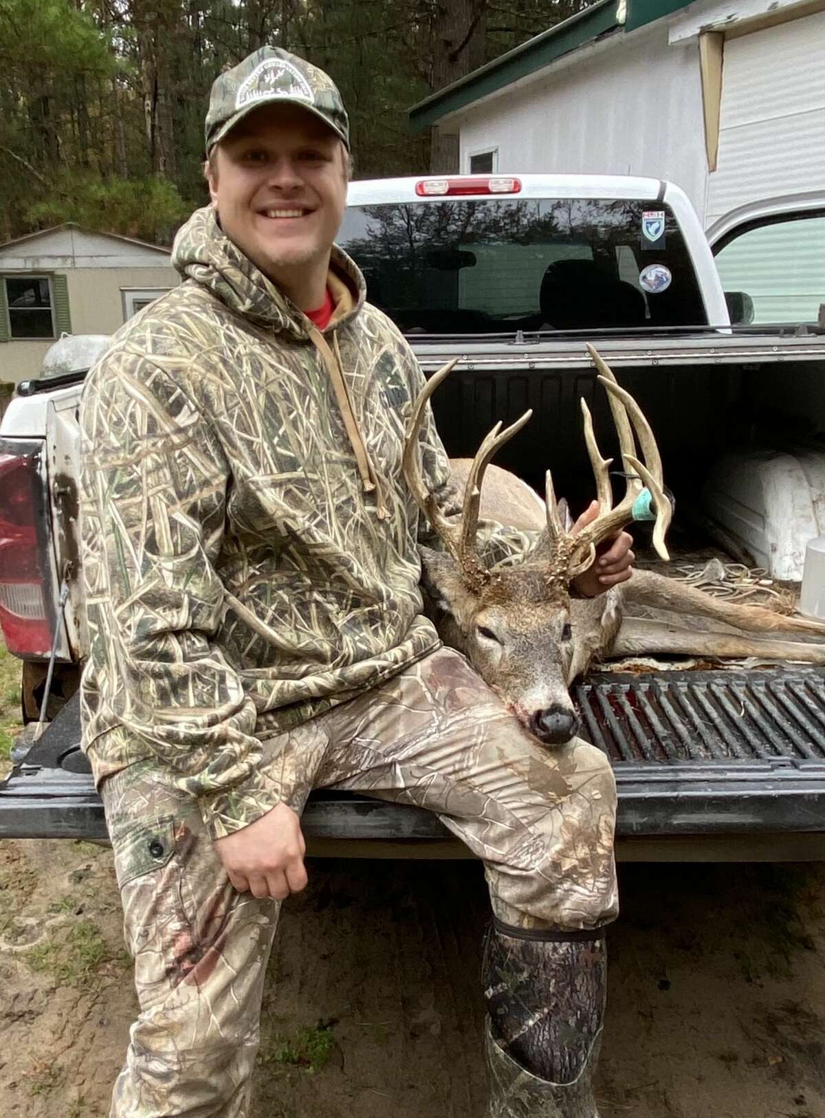 Baldwin's Tyler Clugston shows one of the two bucks he shot during the bow season.