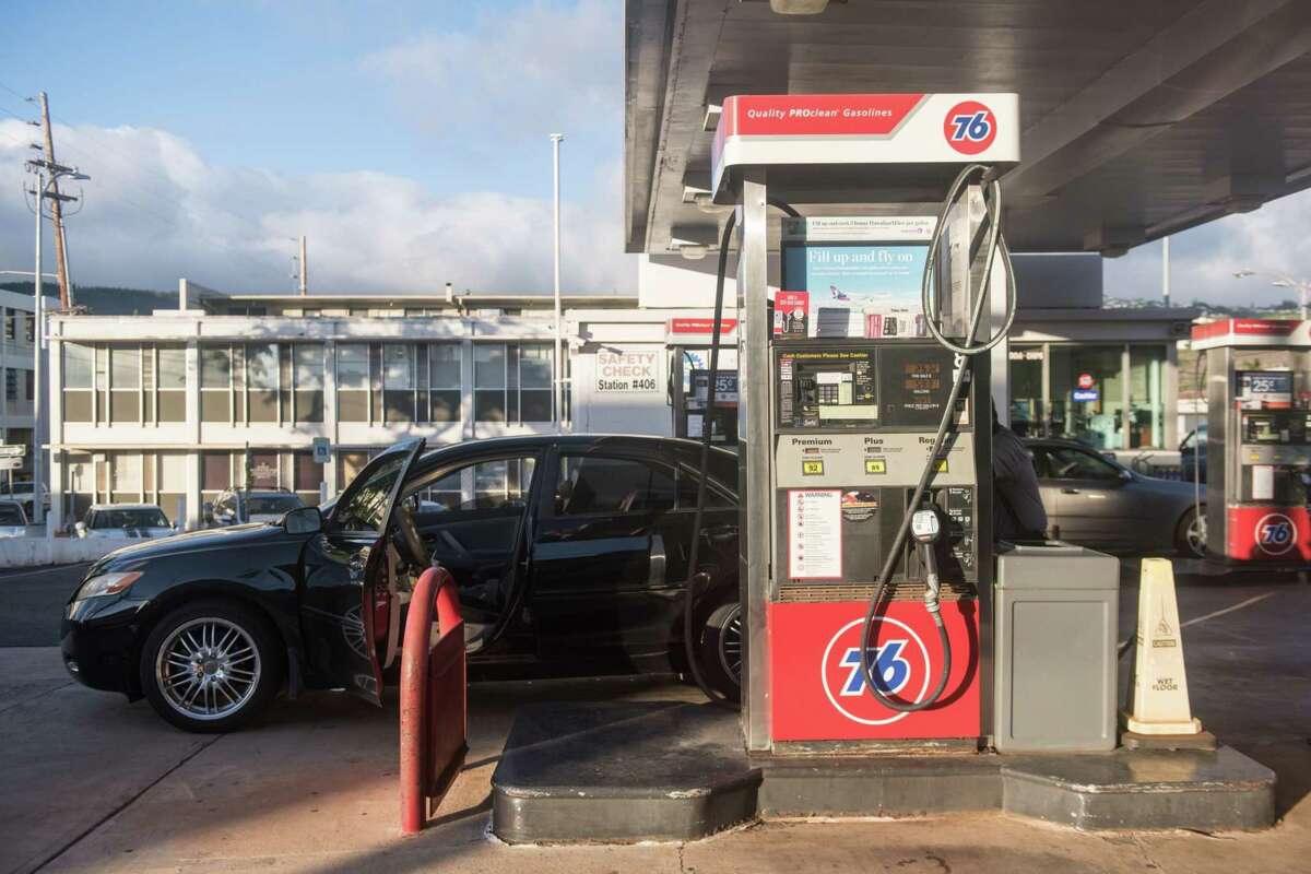 A vehicle refuels at a 76 gas station in the Kaimuki neighborhood of Honolulu on Oct. 27, 2021.