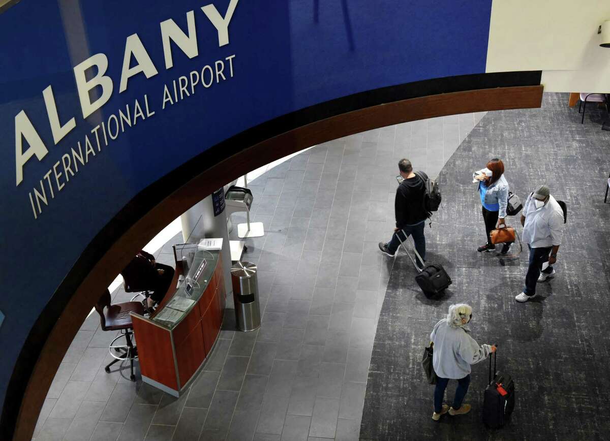 Passengers enter the terminal at Albany International Airport after clearing security on Tuesday, Nov. 9, 2021, in Colonie, N.Y.