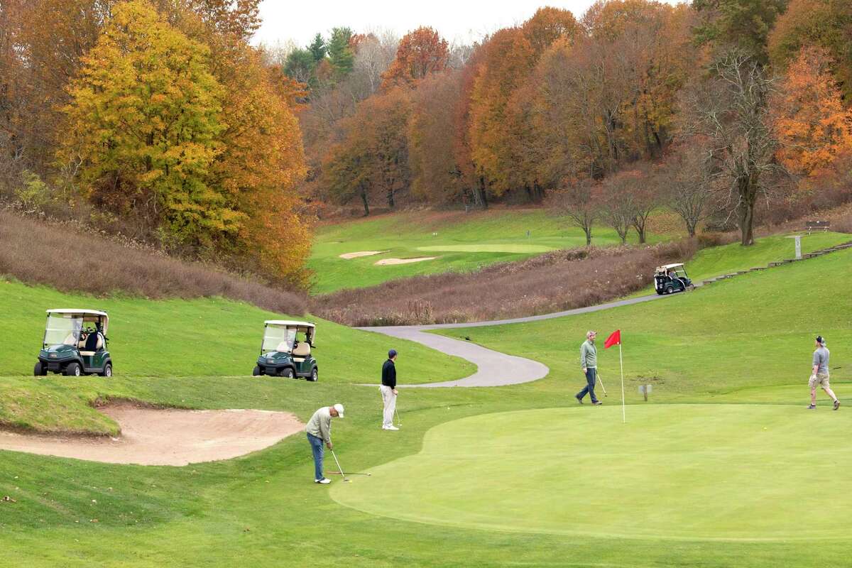 Golfers participate in a round of golf Tuesday, November 9, 2021 before the Capital Hills Golf Course closes for the sea this Sunday in Albany, NY