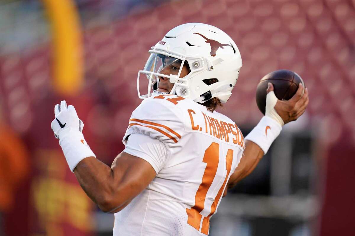 Texas quarterback Casey Thompson (11) warms up before an NCAA college football game against Iowa State, Saturday, Nov. 6, 2021, in Ames, Iowa. (AP Photo/Charlie Neibergall)