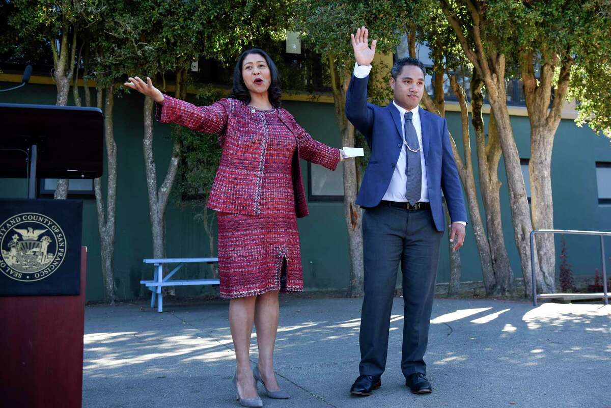 San Francisco Mayor London Breed (left) swears in Faauuga Moliga to the San Francisco Board of Education in 2018. Breed now supports a recall effort to remove three school board members including Moliga.