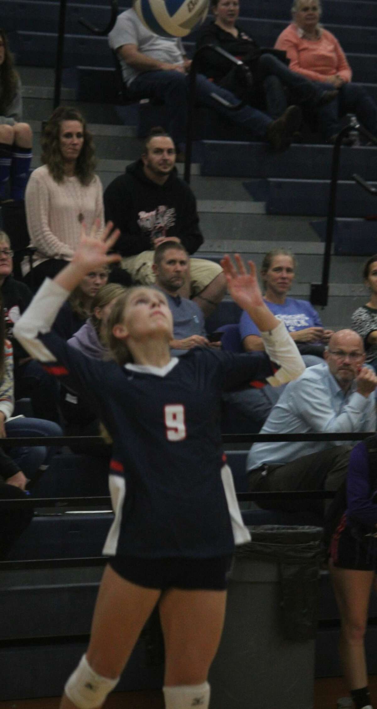 Brenna Mossel prepares to serve during Big Rapids' volleyball season.
