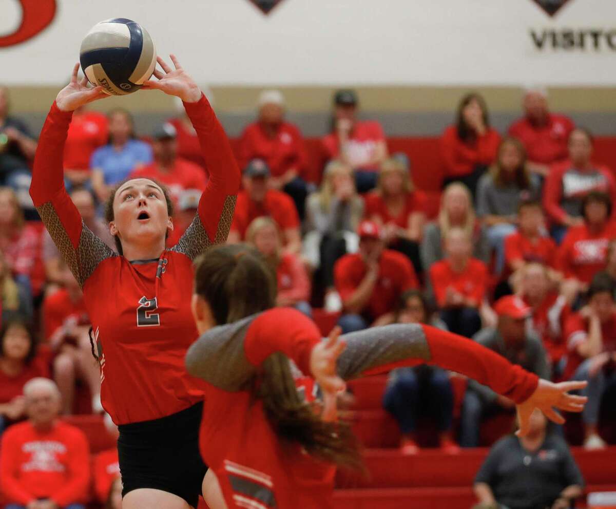 Splendora’s Falon Buford (2) sets the ball in the first set of a high school volleyball Region III-4A quarterfinal match at Cypress Lakes High School, Tuesday, Nov. 9, 2021, in Cypress.