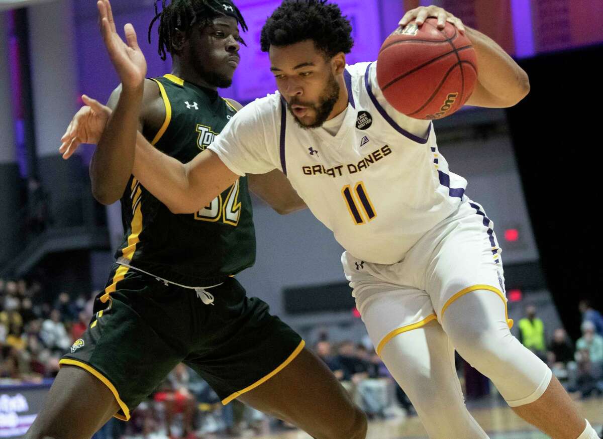 UAlbany’s Tairi Ketner drives to the basket in a game last season against Towson. He averaged just less than five minutes per game as a walk-on last season.